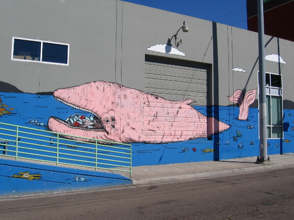 The right side of the mural features a large pink whale.