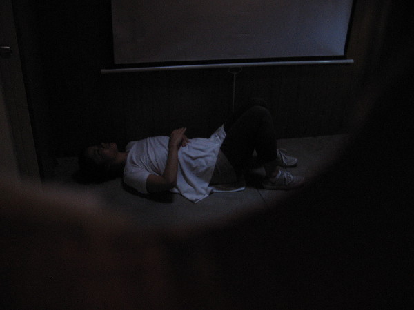 Inside this very bare Model Home someone sleeps in apparent poverty. But every small set and performance is open for the viewer's own interpretation.