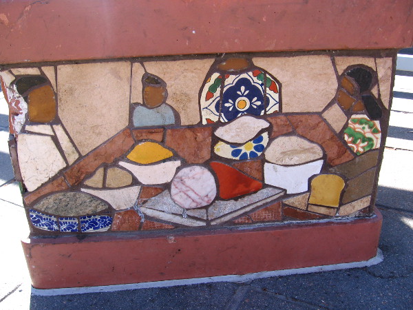 Hispanic family at home around a table laden with food.