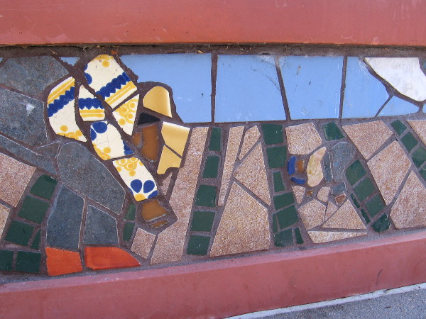 Migrant workers appear to be planting seeds in a field.