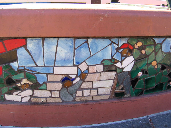 Hispanic workers build a wall.