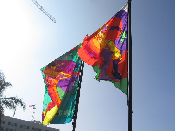 Two of three huge banners that celebrate the history of baseball at San Diego's Lane Field. On the left you can see Ted Williams, one of the greatest Major League Baseball hitters of all time, taking a swing.