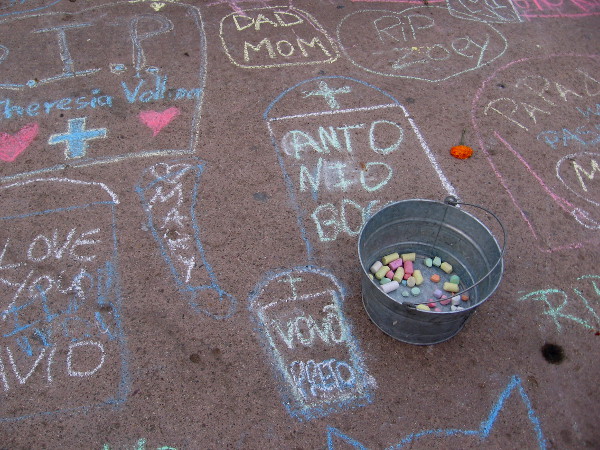 Names and a few loving words. Spiritual magic, linking the living with the dead during Dia del Los Muertos.