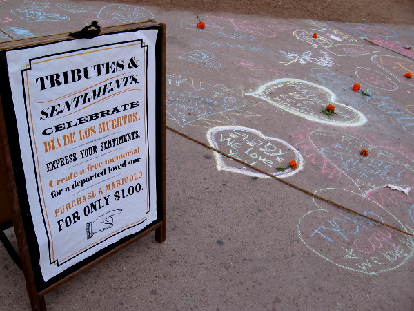 Hundreds of tributes and sentiments for departed loved ones were written with chalk on a long stretch of San Diego Avenue inside the State Historic Park.