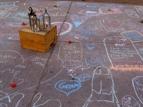 Lanterns among the heartfelt Dia de los Muertos chalk memorials.