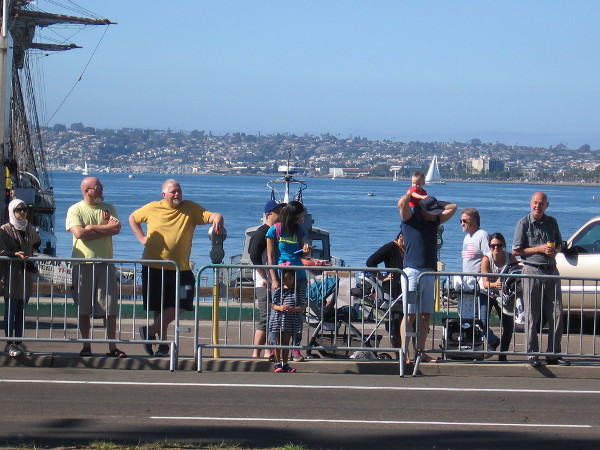 Many would watch the parade from across Harbor Drive, near the Maritime Museum of San Diego.