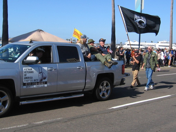 A POW MIA flag follows a group of honored Veterans.
