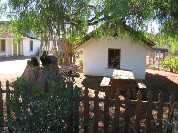In this photo you can see the small creamery building and the base of the restored windmill.