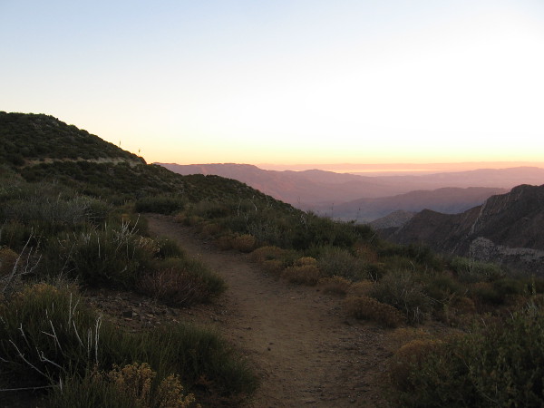 Looking roughly northeast as color creeps over the desert below.