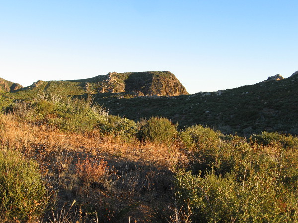 I'm rounding a corner, approaching a light-splashed peak.