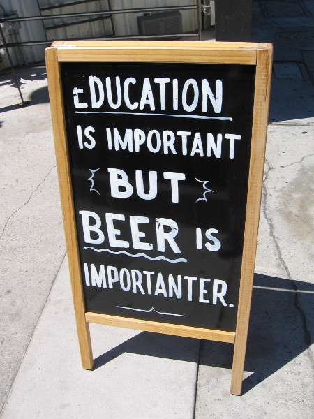Education is important but beer is importanter, according to a sign in front of Coin Haus in La Mesa.