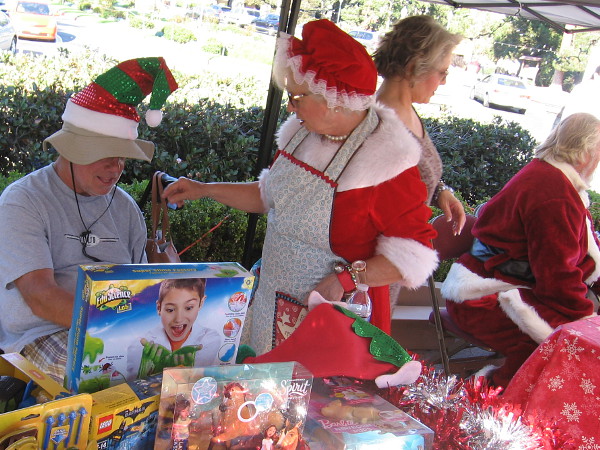 A bunch of folk from the North Pole were getting ready as Christmas on the Prado was almost set to open.