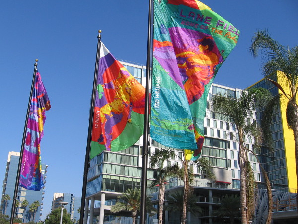 On the center banner, Eddie Erautt pitches the ball.
