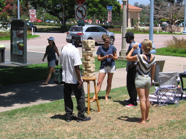 People play Jenga on the grass near Sefton Plaza in Balboa Park.