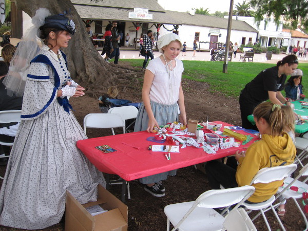 Kids activities during Las Posadas included making Christmas tree ornaments.