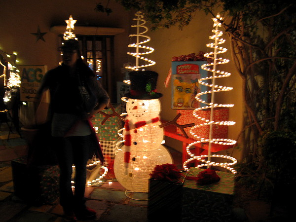 A fun, illuminated snowman in Spanish Village. Festive lights dazzle at 2017 December Nights.