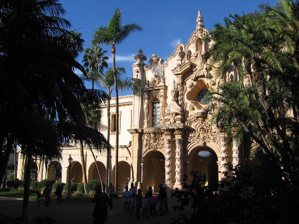 People are entertained on El Prado one beautiful winter's day in Balboa Park. The facade of the Casa del Prado makes a fantastic backdrop.