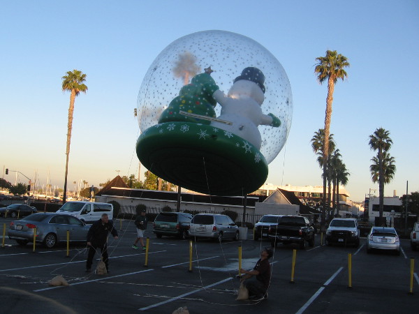 Back where the Holiday Bowl Parade balloons were being inflated, a snow globe containing Frosty was rising like magic into the blue San Diego sky.
