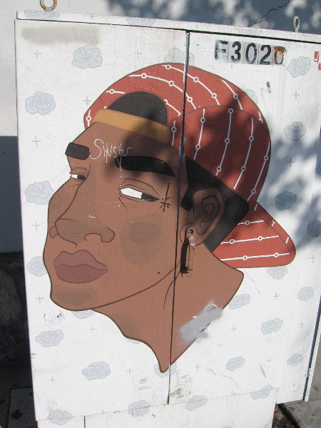 A cool street art face in North Park.