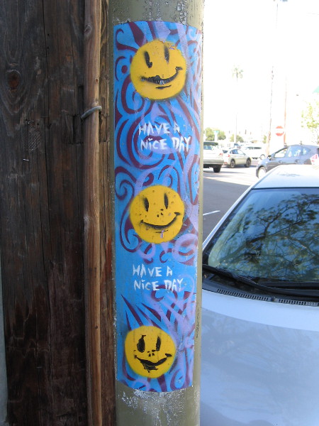 Three somewhat sickly smileys on a Have a Nice Day sticker.