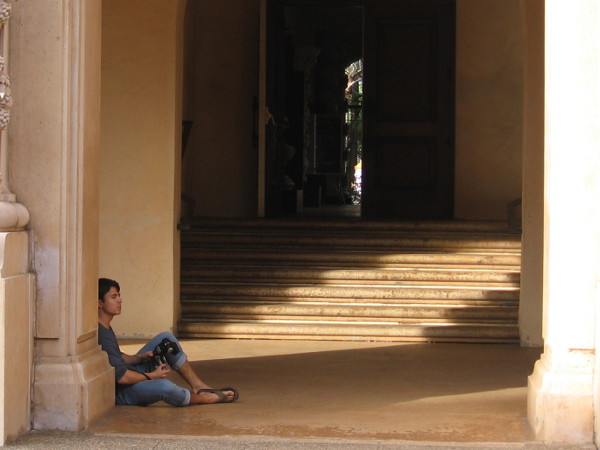 Resting among shadows and light with a camera.