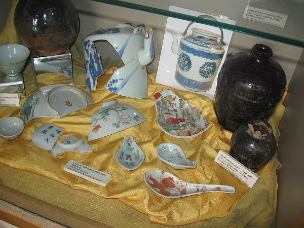 Fragments of earthenware jars and Chinese and Japanese ceramic tableware show Asian culture that thrived in the neighborhood's past.