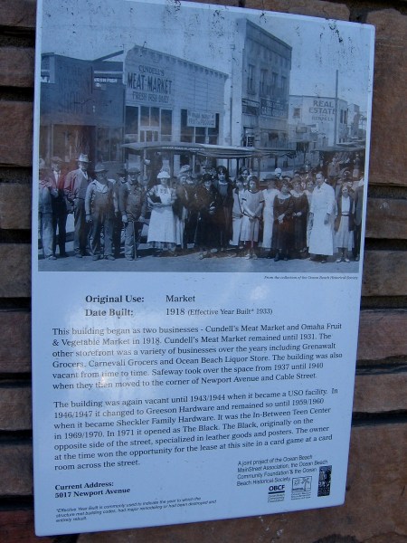 Old photo on the building at 5017 Newport Avenue in Ocean Beach shows a couple of local markets. The Black's owner won the right to lease in the building after winning a card game across the street.