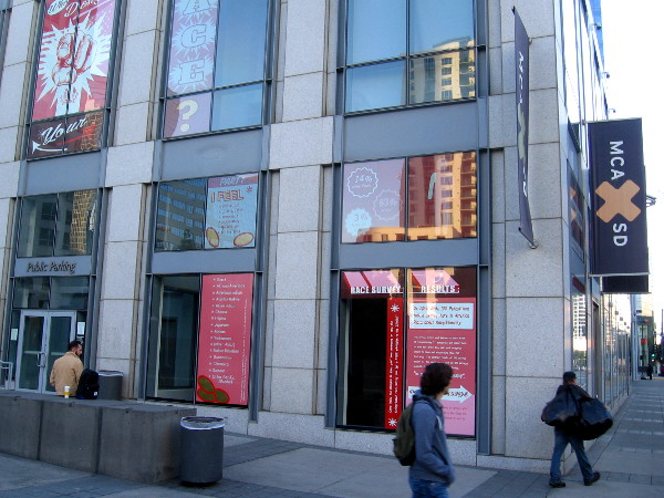 People walk past the Museum of Contemporary Art San Diego's gallery at America Plaza.