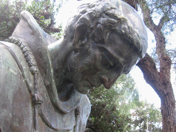 Close photo of bowed head of The Padre on Presidio Hill.