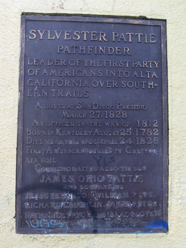 The plaque begins: Sylvester Pattie, pathfinder, leader of the first party of Americans into Alta California over Southern trails. Arrived at San Diego Presidio March 27, 1828.