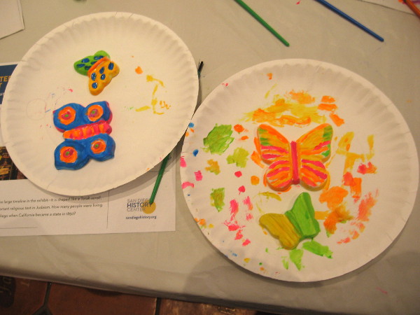 Ceramic butterflies are painted. Each one symbolizes a young person who died as a result of the Holocaust.