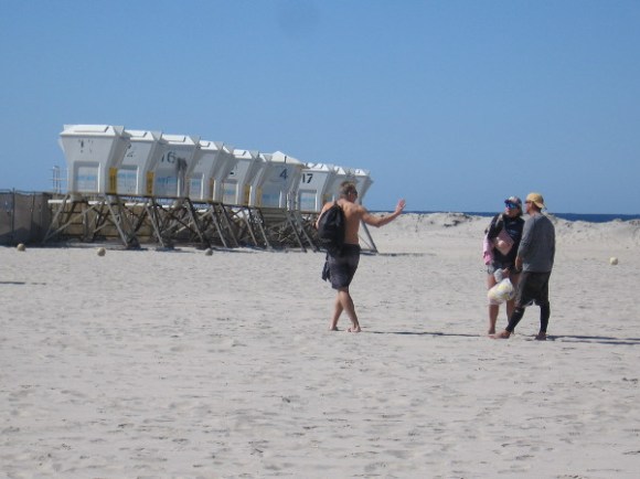 A row of lifeguard towers. It's winter in San Diego. During the summer these lookouts will be arranged at intervals along the beach.