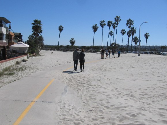 Heading south along the path, approaching the parking lot at the jetty.