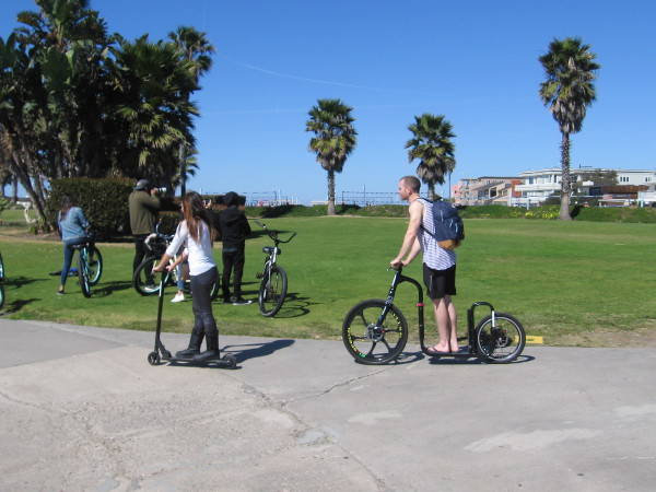 These people have paused to look at the nearby grass.
