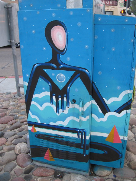 A second side. Weird humanoid figures seem composed of fluid ink.