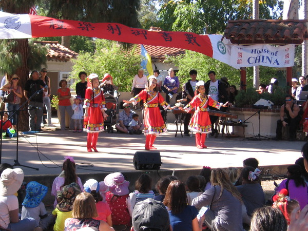 Young students working with the Confucius Institute at San Diego State University dance during the program.