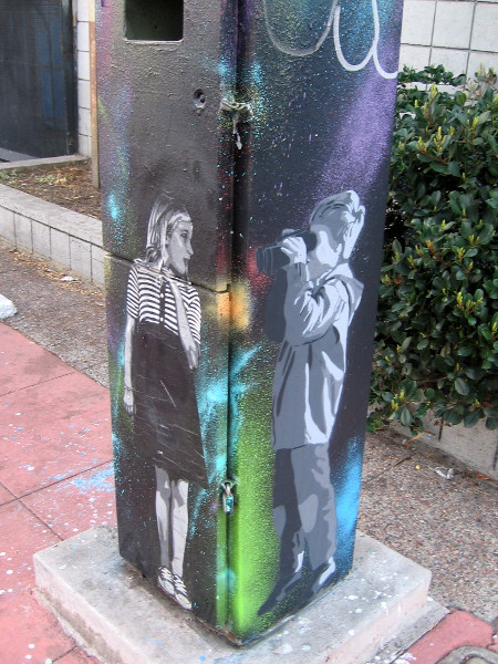 A young girl, and a young boy with binoculars.