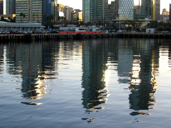 Reflections of buildings along San Diego's waterfront. Like fragments of dancing light, these visions change as years pass.