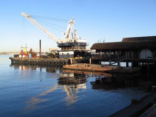 A crane on a barge. The demolition of Anthony's Fish Grotto on the Embarcadero has begun.