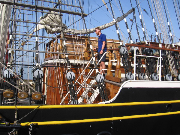 Another friendly crew member near one of the elegant wood cabins on deck.