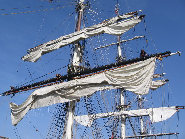 The majestic ship has masts that touch the sky.