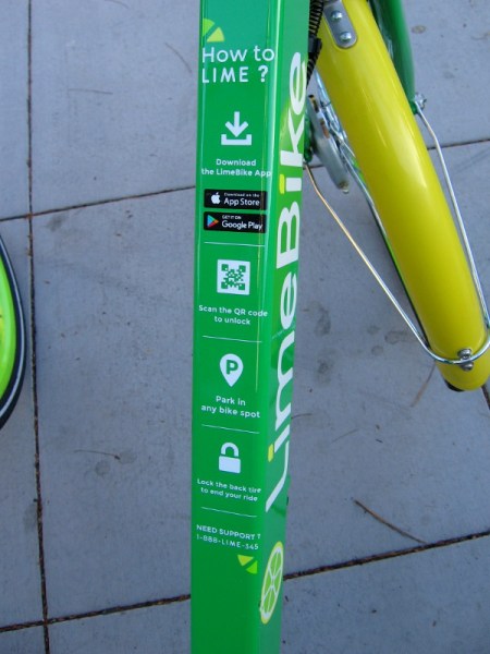 Instructions on a LimeBike show how to scan the QR code to unlock the bicycle.