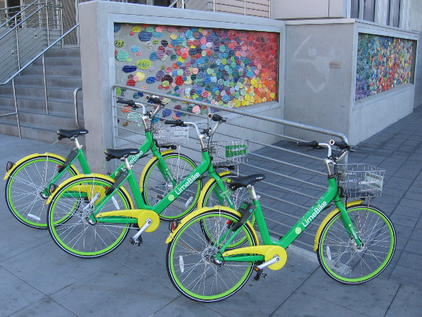 I found more LimeBikes parked on the sidewalk near some colorful public art at the Little Italy trolley station!