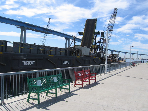 A huge barge and crane are nearby, and so is the Coronado Bay Bridge.