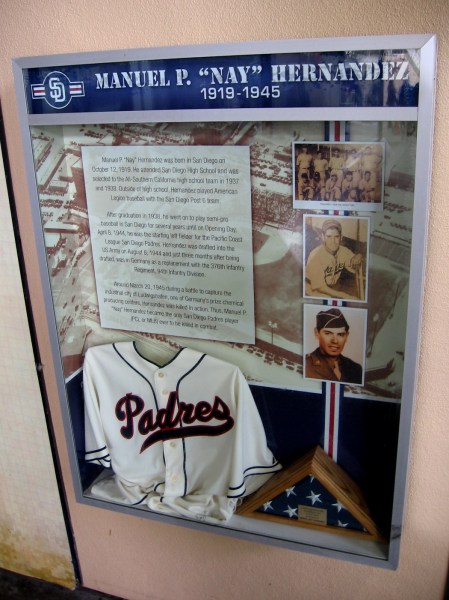Display inside Petco Park's Power Alley honors Manuel P. Hernandez of San Diego. Before the start of World War II he played for the Pacific Coast League Padres. He died in action fighting the Nazis in Germany.