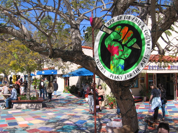 Rise Up For the Arts and Culture. Preserve Penny For the Arts. A sign in Spanish Village, where the Balboa Park Cultural Partnership and San Diego Regional Arts and Culture Coalition recently held an event.