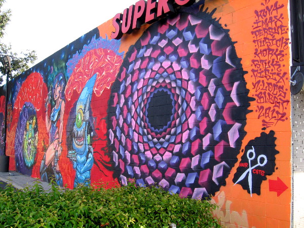 Ten street artists have their names on one side of this fantastic, complex spray paint art in North Park.