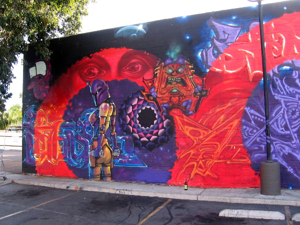 Looks to me like a sexy lady Boba Fett and Marvel's lethal super villain MODOK in his hover chair.