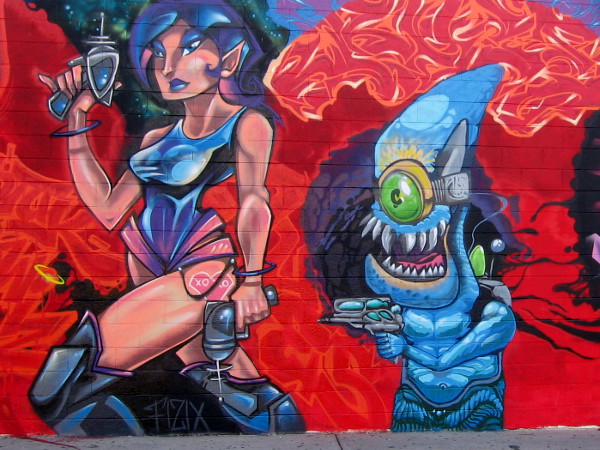 Two elements of a fun spray paint mural near the corner of El Cajon Boulevard and 30th Street in North Park.