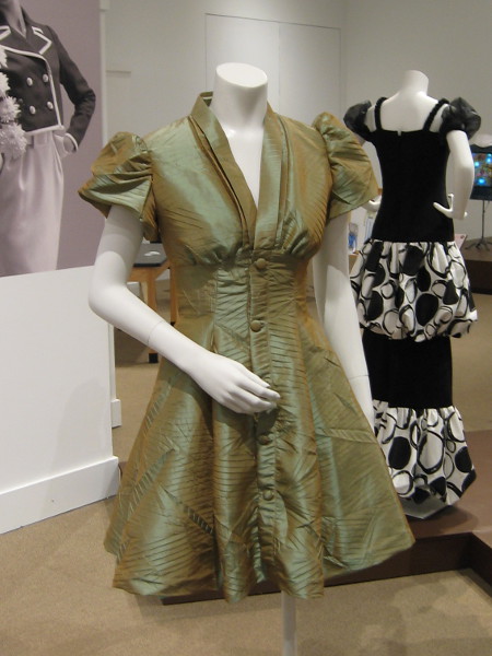 This 1940's style dress was created by student designer Anna Acosta. In that decade garments were often designed to soften a woman's shape, create a sense of elegance.